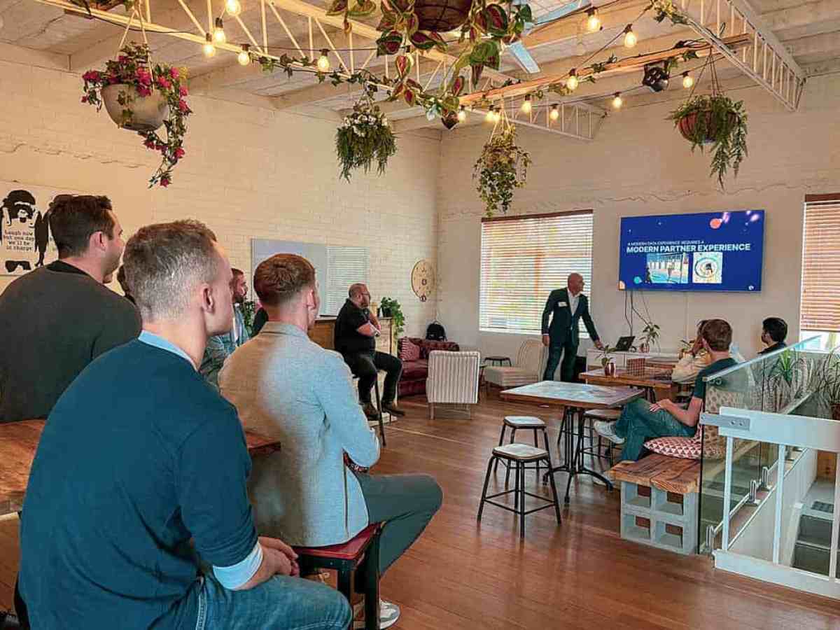 a group of people sitting around a living room