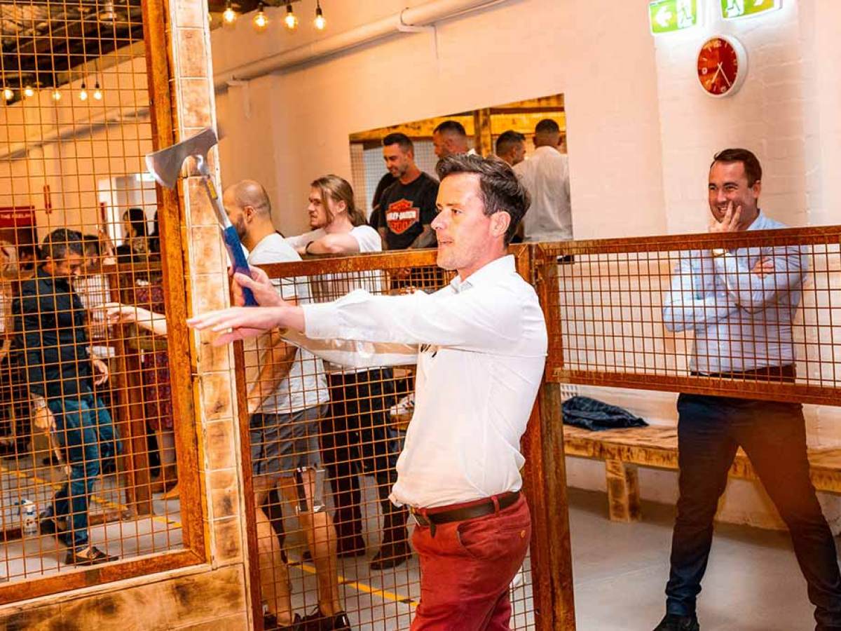 a group of people in a cage