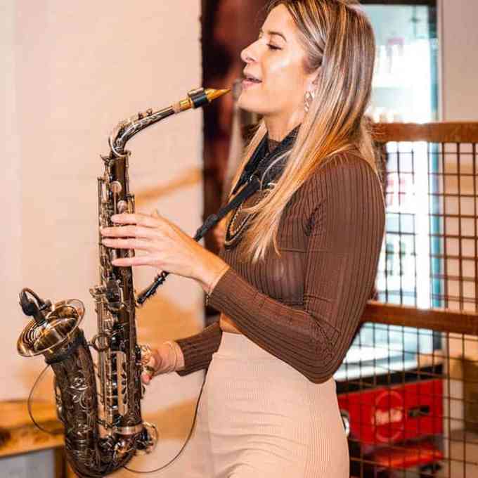 a woman holding a guitar