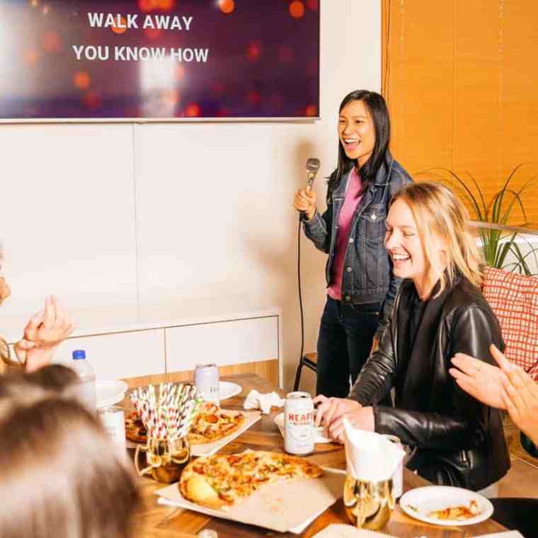 a group of people sitting at a table in a restaurant