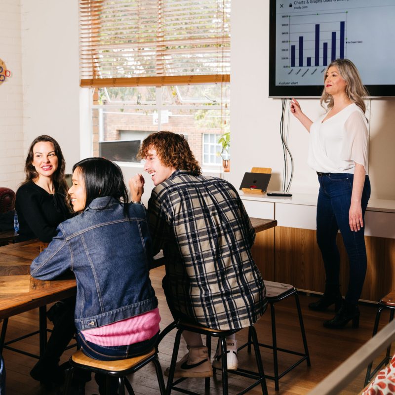 a group of people standing in a living room