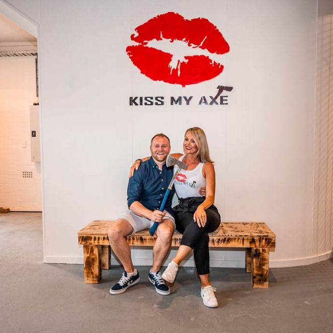 a man and a woman sitting on a bench