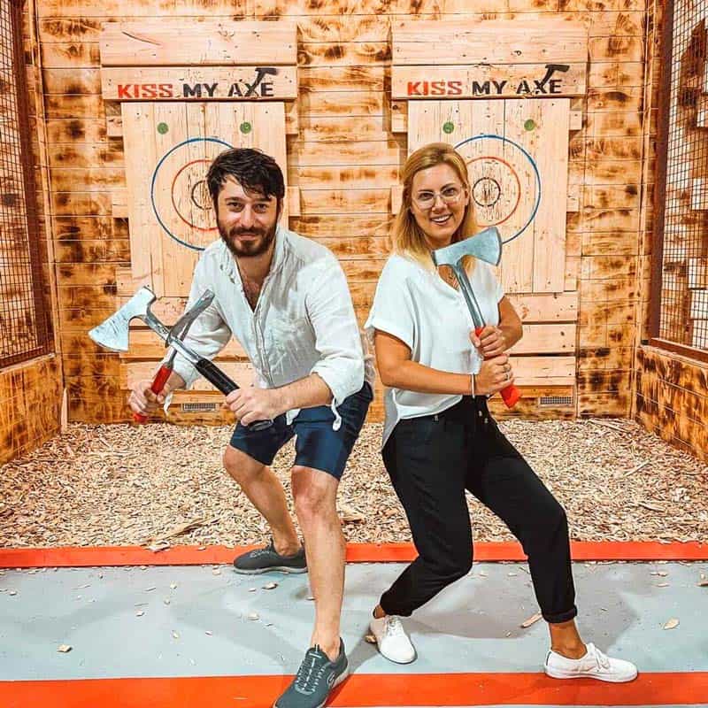 a man holding a sign posing for the camera