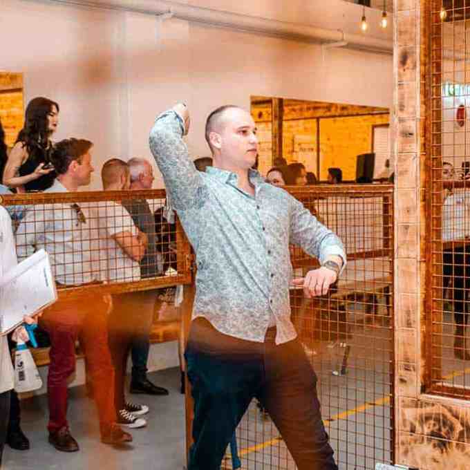 a couple of people that are standing in a room