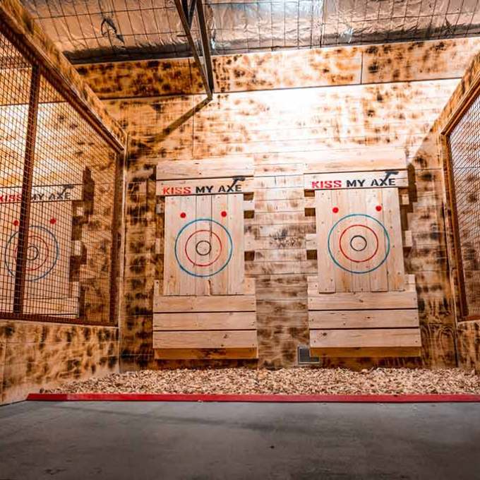 a building with graffiti on the side of a fence