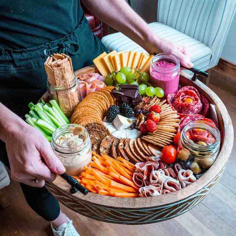 a woman sitting at a table with food