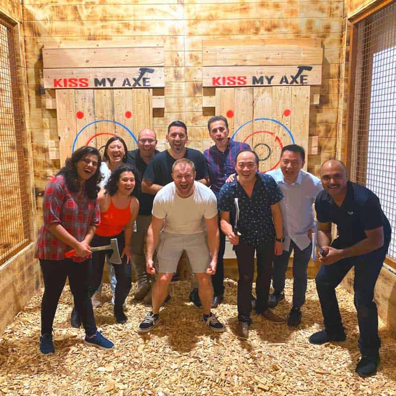a group of people standing in front of a crowd posing for the camera