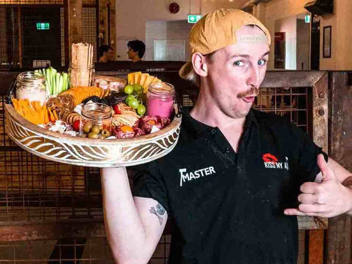 a man holding a plate of food