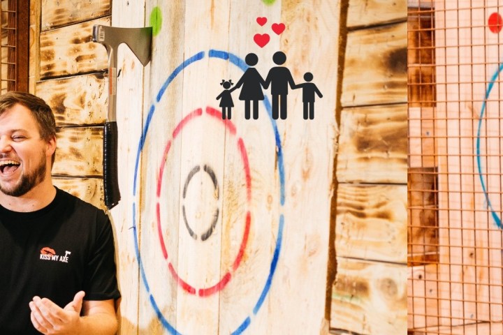 man standing in front of the axe throwing target