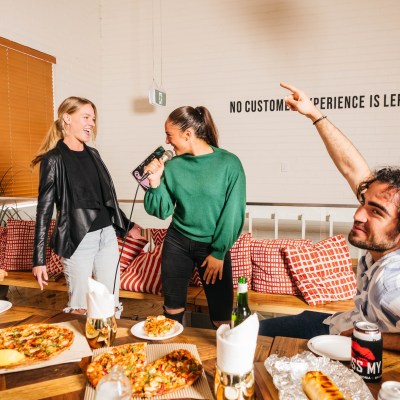 a group of people hosting an event at Kiss My Axe