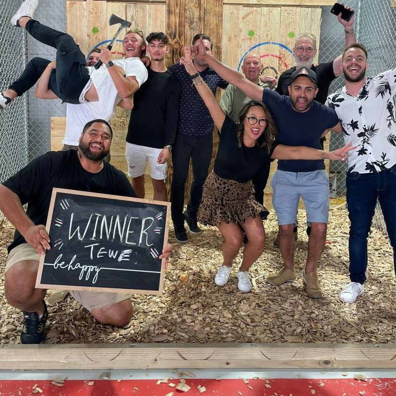 a group of people holding a sign