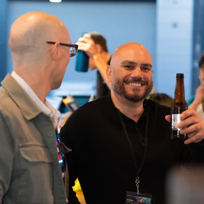 two man holding drinks at a Kiss My Axe Corporate Event in Sydney